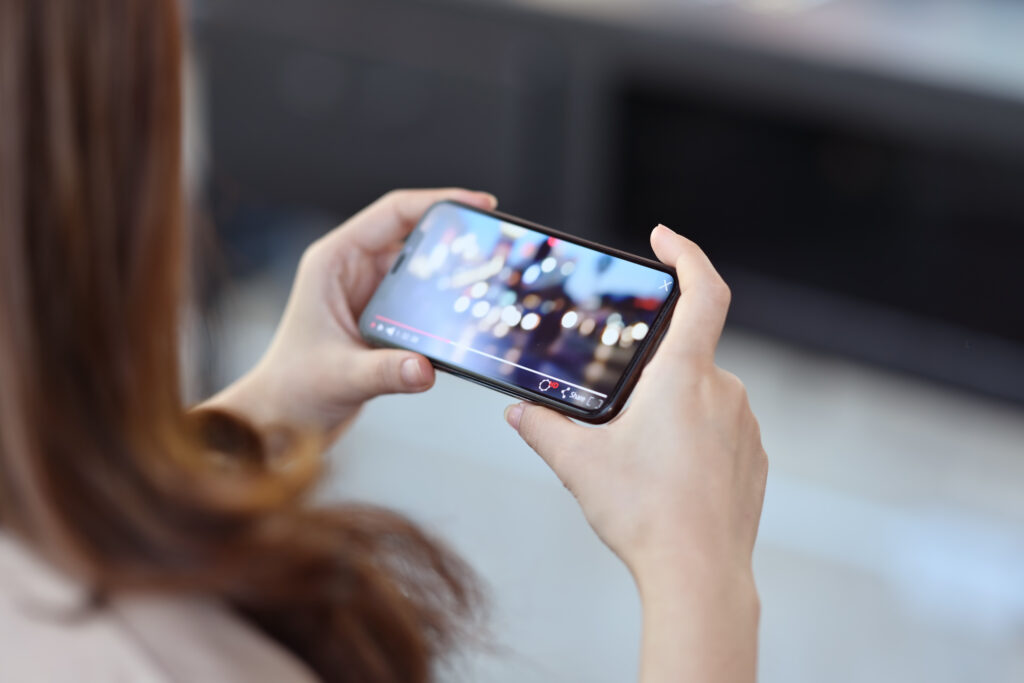 Person watching a YouTube video on a smartphone